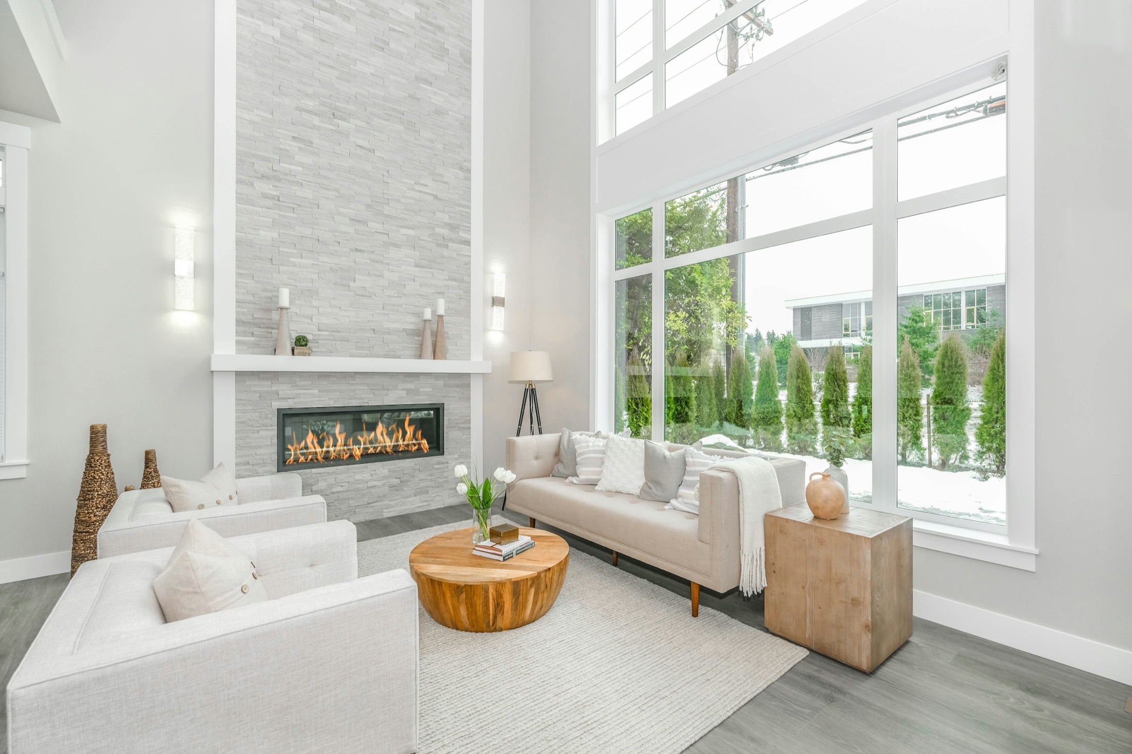 Double-height living room with tall windows