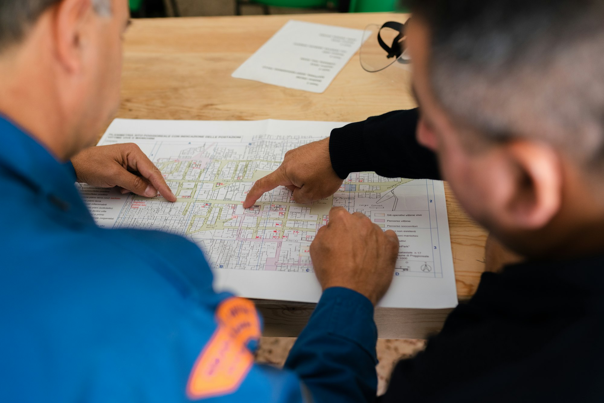 Engineers reviewing a printed plan